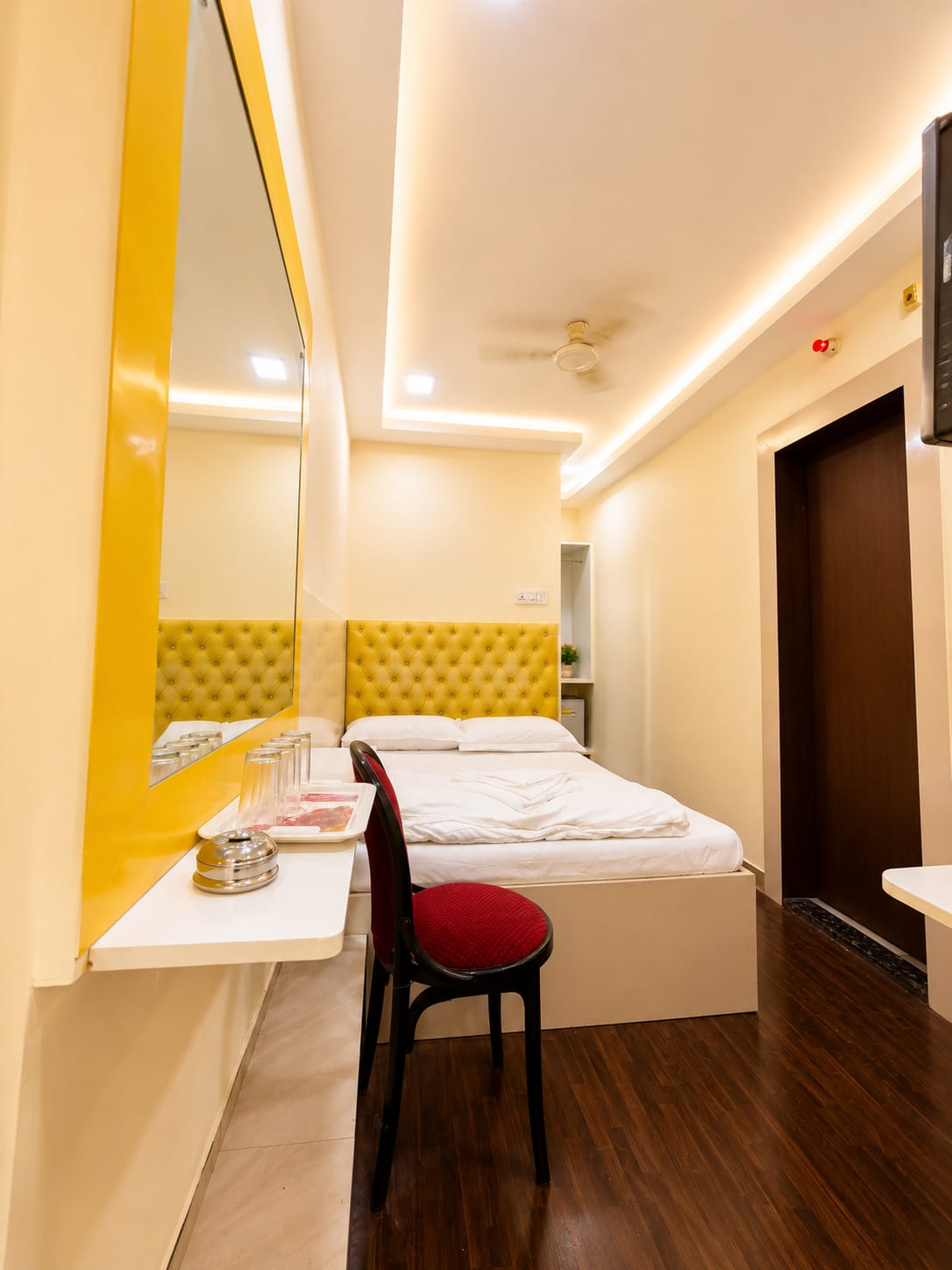 SANA room with doorway and bed